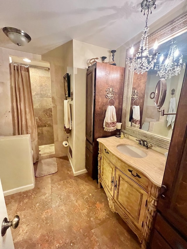 1503 Buena Vista Dr, Dothan, AL 36303 - bathroom featuring a tile shower, vanity, and a chandelier