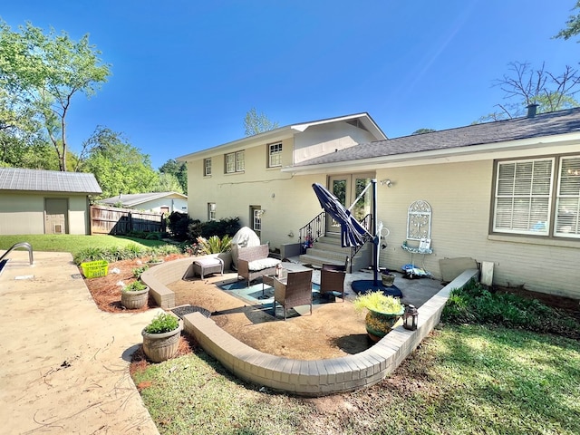 1503 Buena Vista Dr, Dothan, AL 36303 - rear view of house with a patio, entry steps, and outdoor lounge area