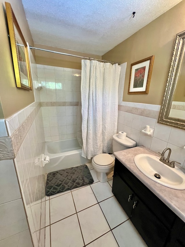 1503 Buena Vista Dr, Dothan, AL 36303 - bathroom with tile walls, shower / tub combo with curtain, tile patterned flooring, vanity, and toilet