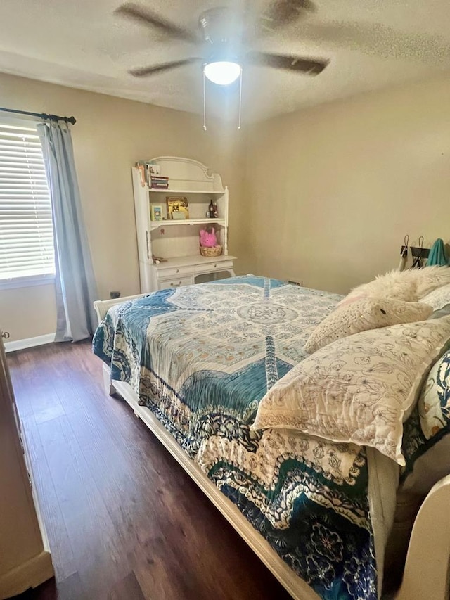1503 Buena Vista Dr, Dothan, AL 36303 - bedroom with wood finished floors, a ceiling fan, baseboards, and a textured ceiling