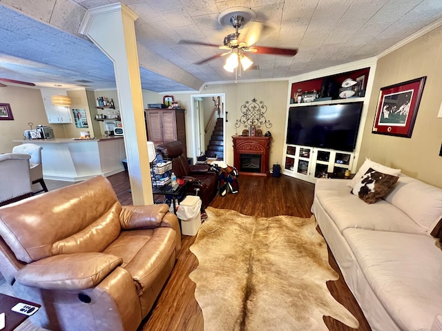 1503 Buena Vista Dr, Dothan, AL 36303 - living room with wood finished floors, ceiling fan, built in features, crown molding, and stairway