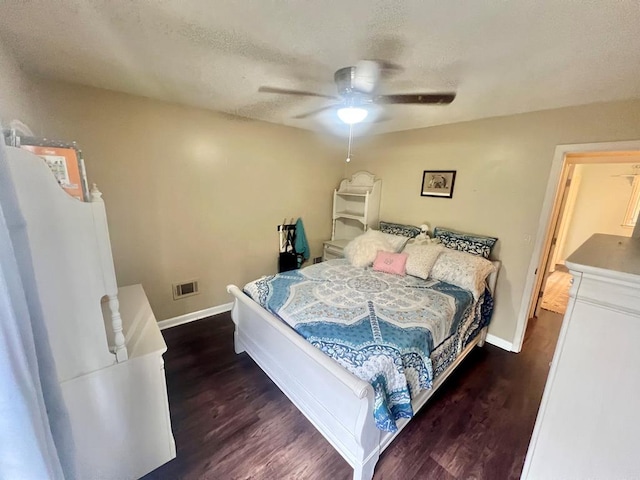 1503 Buena Vista Dr, Dothan, AL 36303 - bedroom with baseboards, wood finished floors, ceiling fan, and a textured ceiling