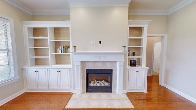 107 Boulder Dr, Dothan, AL 36305 - unfurnished living room featuring ornamental molding, light wood-style floors, plenty of natural light, a fireplace, and baseboards