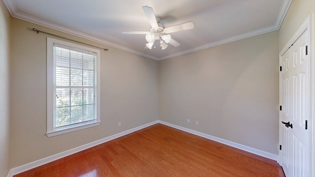 107 Boulder Dr, Dothan, AL 36305 - spare room featuring wood finished floors, healthy amount of natural light, baseboards, crown molding, and ceiling fan