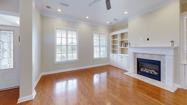 107 Boulder Dr, Dothan, AL 36305 - unfurnished living room with wood finished floors, a fireplace, ornamental molding, ceiling fan, and baseboards