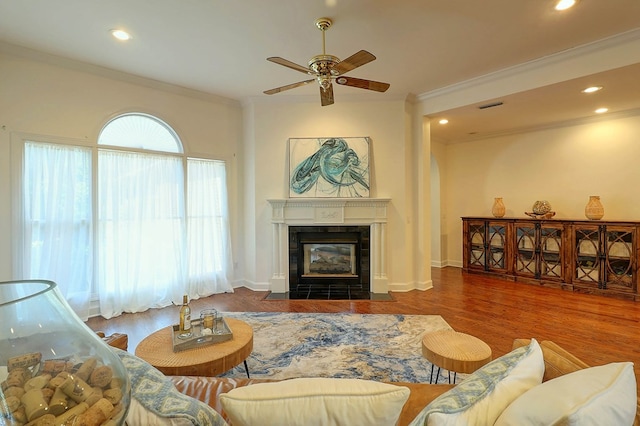 221 Asphodel Dr, Dothan, AL 36303 - living room featuring crown molding, a ceiling fan, wood finished floors, a tile fireplace, and recessed lighting