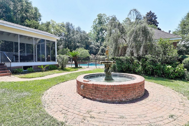 221 Asphodel Dr, Dothan, AL 36303 - view of patio / terrace featuring a sunroom and an outdoor pool