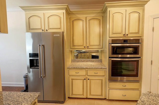 221 Asphodel Dr, Dothan, AL 36303 - kitchen with appliances with stainless steel finishes, cream cabinets, ornamental molding, and light stone countertops