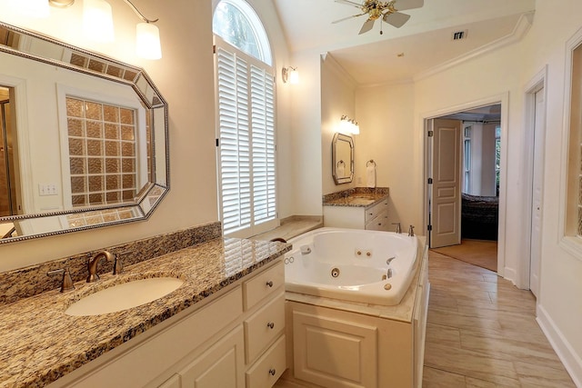 221 Asphodel Dr, Dothan, AL 36303 - bathroom featuring two vanities, ceiling fan, and a jetted tub