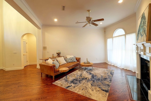 221 Asphodel Dr, Dothan, AL 36303 - living area with arched walkways, crown molding, ceiling fan, dark wood-style flooring, and recessed lighting