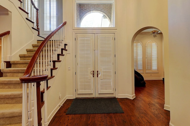 221 Asphodel Dr, Dothan, AL 36303 - entryway with dark wood-style floors, stairs, arched walkways, and a high ceiling