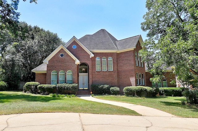 221 Asphodel Dr, Dothan, AL 36303 - view of front of property with brick siding, a front yard, and a shingled roof