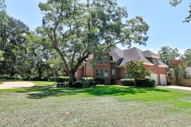 221 Asphodel Dr, Dothan, AL 36303 - view of side of home with a garage, driveway, and brick siding
