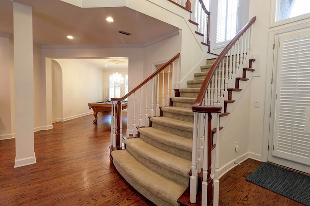 221 Asphodel Dr, Dothan, AL 36303 - stairway with ornamental molding, arched walkways, wood finished floors, recessed lighting, and a chandelier
