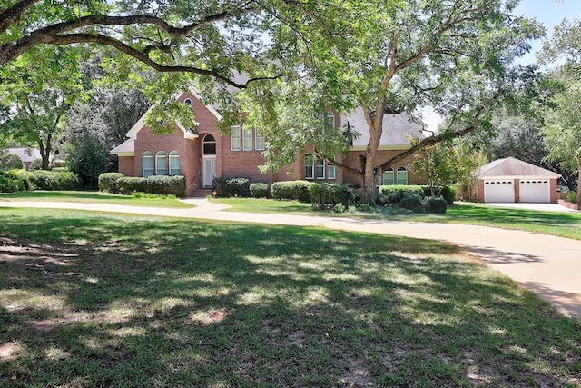 221 Asphodel Dr, Dothan, AL 36303 - view of front facade featuring a front lawn, a garage, brick siding, and concrete driveway