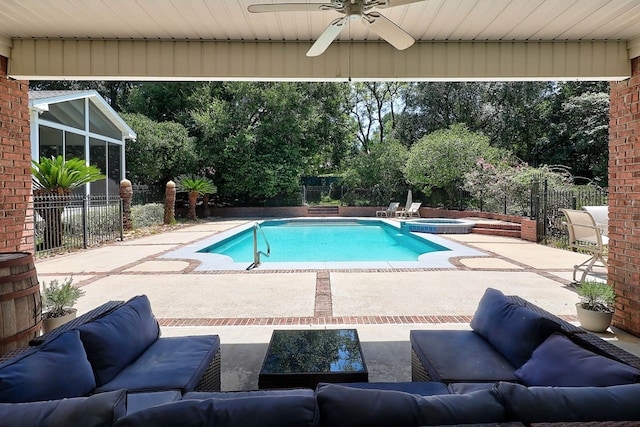 221 Asphodel Dr, Dothan, AL 36303 - view of swimming pool featuring a ceiling fan, a patio, an outdoor hangout area, a pool with connected hot tub, and a fenced backyard
