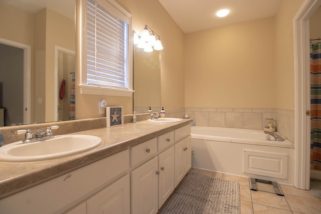 bathroom featuring vanity and a tub