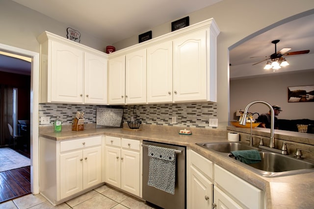 kitchen featuring dishwasher, white cabinets, light wood-type flooring, and sink