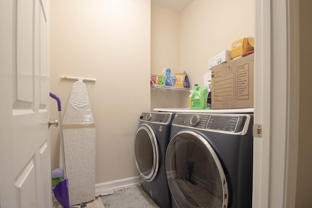 laundry room featuring washer and clothes dryer