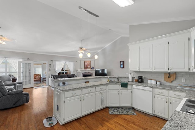 kitchen featuring white dishwasher, white cabinets, kitchen peninsula, and ceiling fan