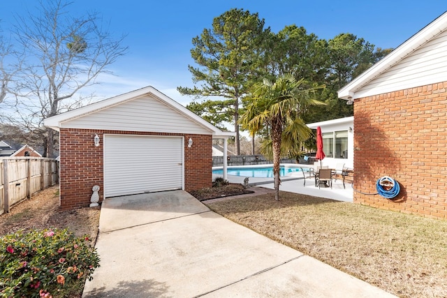 garage featuring a fenced in pool