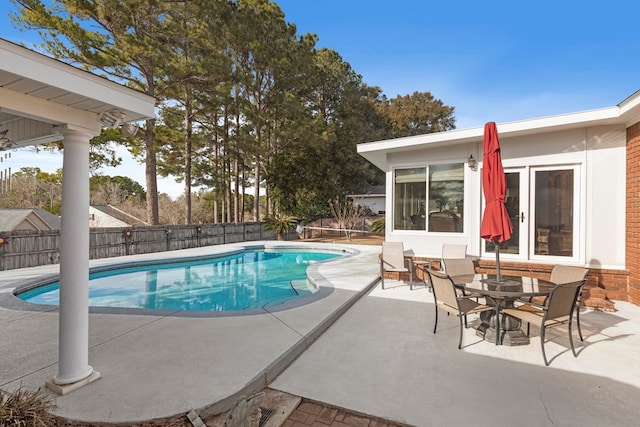 view of swimming pool featuring a patio area