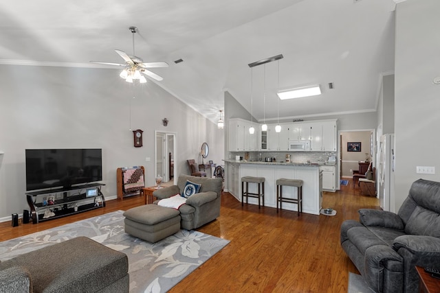 living room with ceiling fan, crown molding, and dark hardwood / wood-style floors