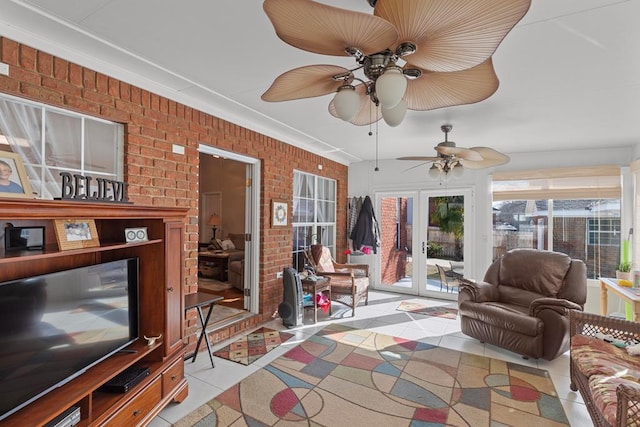 sunroom / solarium featuring ceiling fan