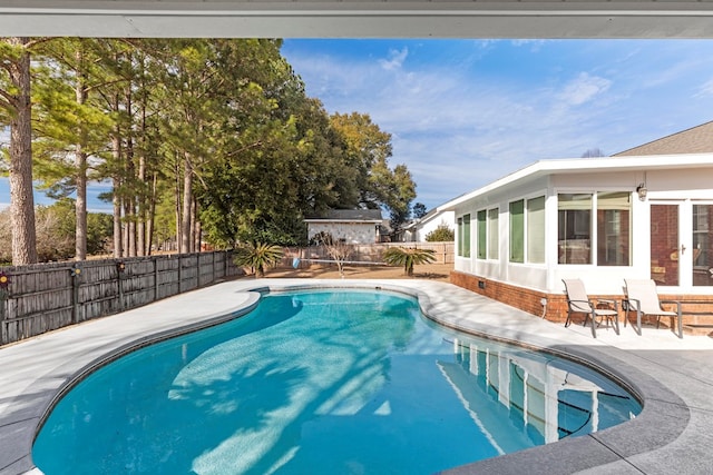 view of swimming pool with a patio area