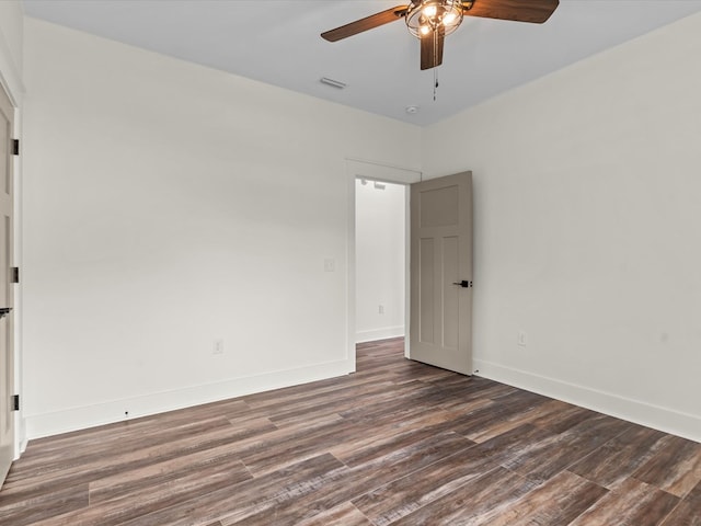 328 Lakes Dr, Enterprise, AL 36330 - spare room with a ceiling fan, dark wood-style flooring, and baseboards