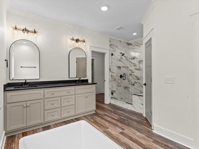 328 Lakes Dr, Enterprise, AL 36330 - full bathroom with double vanity, a marble finish shower, wood finished floors, and a sink