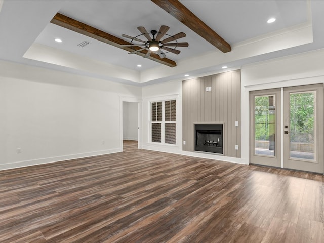328 Lakes Dr, Enterprise, AL 36330 - unfurnished living room with dark wood-style flooring, beamed ceiling, baseboards, and ceiling fan