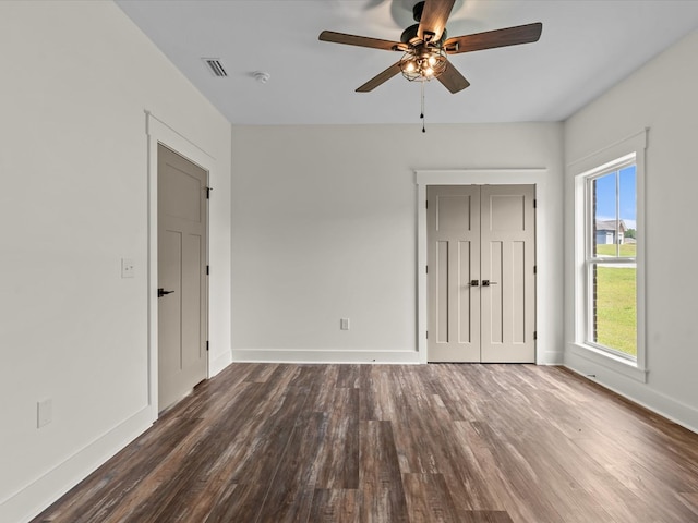 328 Lakes Dr, Enterprise, AL 36330 - unfurnished bedroom featuring wood finished floors, a ceiling fan, a closet, visible vents, and baseboards