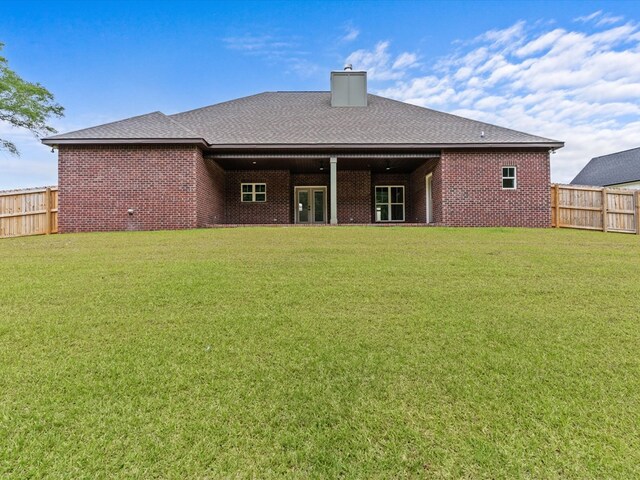 328 Lakes Dr, Enterprise, AL 36330 - back of house with a lawn, brick siding, french doors, and a fenced backyard