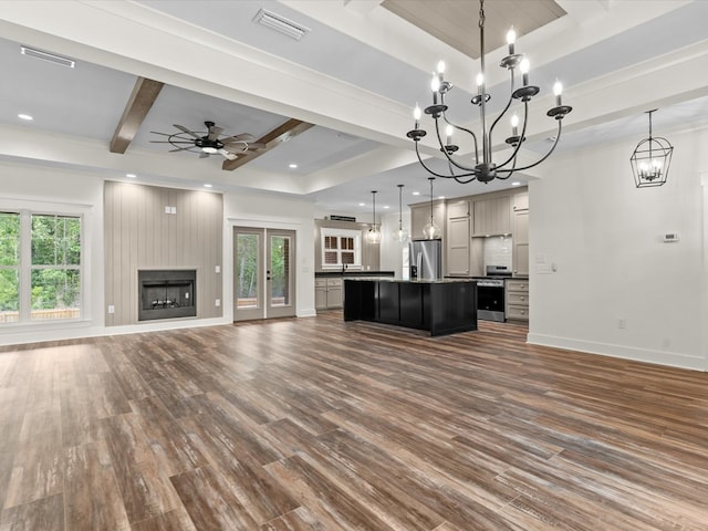 328 Lakes Dr, Enterprise, AL 36330 - unfurnished living room with beam ceiling, ceiling fan with notable chandelier, baseboards, and dark wood finished floors