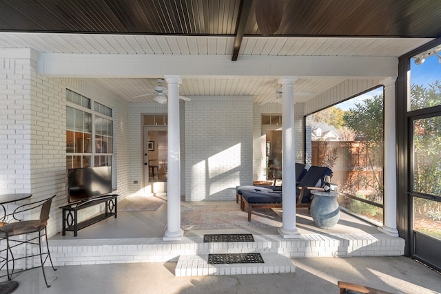 view of patio featuring ceiling fan