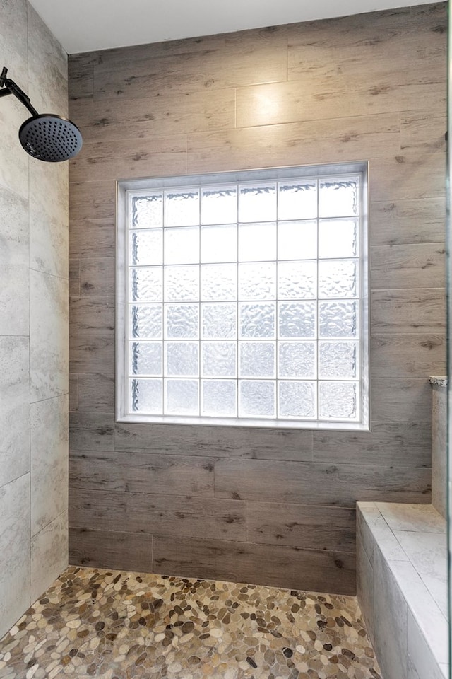 bathroom with tiled shower