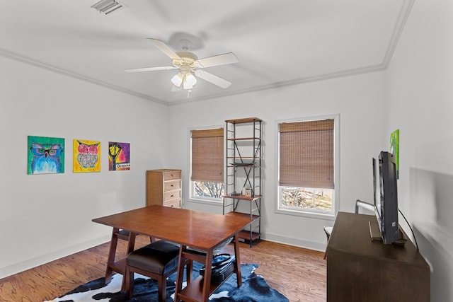 office area featuring light hardwood / wood-style flooring, ceiling fan, and ornamental molding