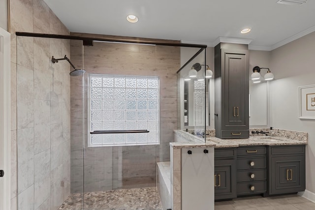 bathroom featuring a shower with door, vanity, and ornamental molding