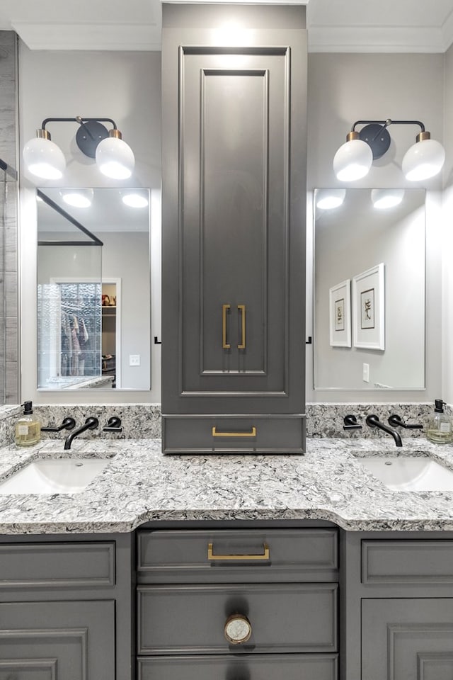 bathroom featuring vanity and ornamental molding