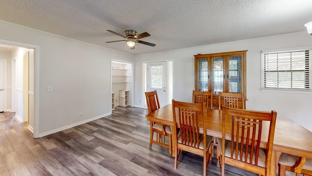 505 Massee Dr, Dothan, AL 36301 - dining area with crown molding, ceiling fan, a textured ceiling, and wood finished floors