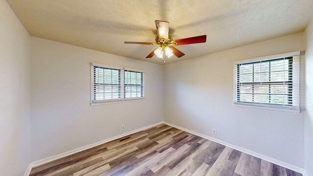 505 Massee Dr, Dothan, AL 36301 - empty room featuring wood finished floors and a ceiling fan