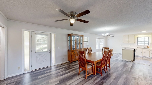 505 Massee Dr, Dothan, AL 36301 - dining space with a textured ceiling, dark wood finished floors, a chandelier, ceiling fan, and crown molding