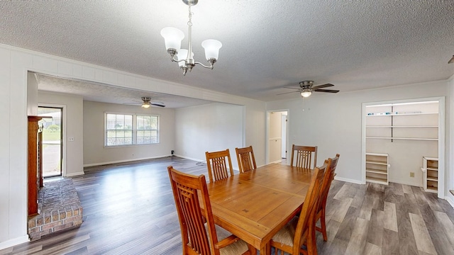 505 Massee Dr, Dothan, AL 36301 - dining room featuring a textured ceiling, a ceiling fan, wood finished floors, a chandelier, and ornamental molding