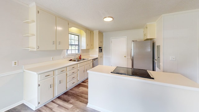 505 Massee Dr, Dothan, AL 36301 - kitchen with appliances with stainless steel finishes, light wood-style floors, open shelves, a textured ceiling, and light countertops