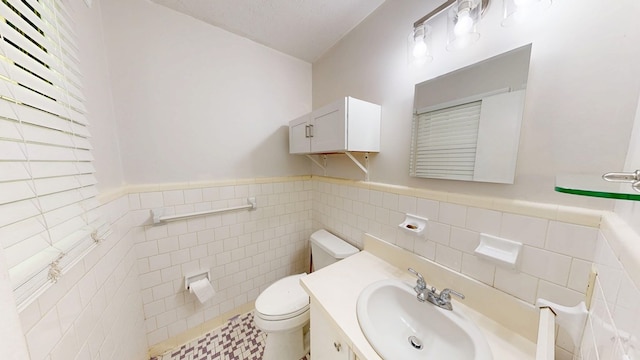 505 Massee Dr, Dothan, AL 36301 - bathroom featuring tile walls, vanity, and a wainscoted wall