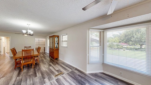 505 Massee Dr, Dothan, AL 36301 - dining area with ceiling fan, a textured ceiling, wood finished floors, and crown molding
