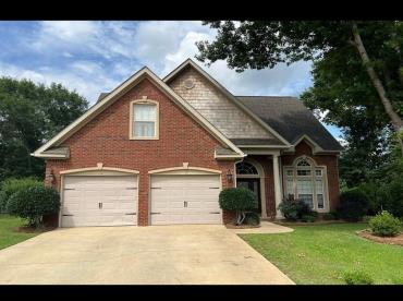 211 Paul Revere Run, Dothan, AL 36305 - view of front of home with driveway, a front yard, and brick siding