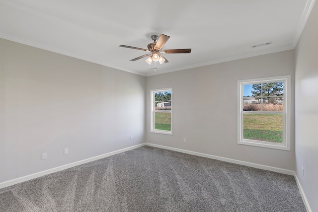 unfurnished room featuring carpet, a wealth of natural light, ornamental molding, and ceiling fan