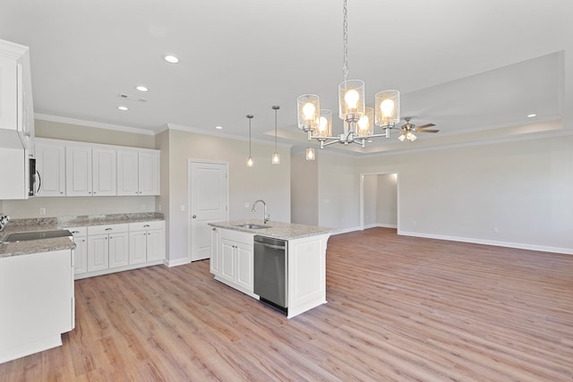 kitchen featuring pendant lighting, stainless steel appliances, white cabinetry, and a kitchen island with sink